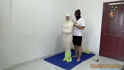 A girl is wrapped in a prayer position and given a stimulus with a vibrator still 1