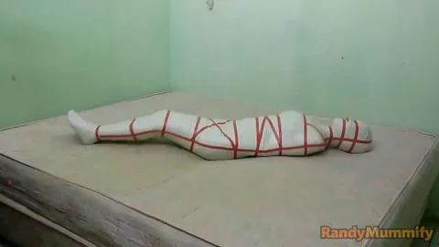 A sailor cosplay girl is mummified into helplessness