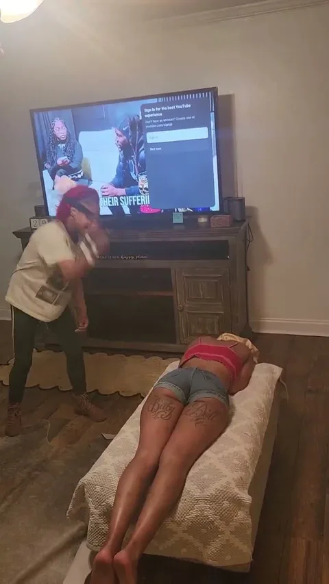Chick gets a hard spanking laying down still 1