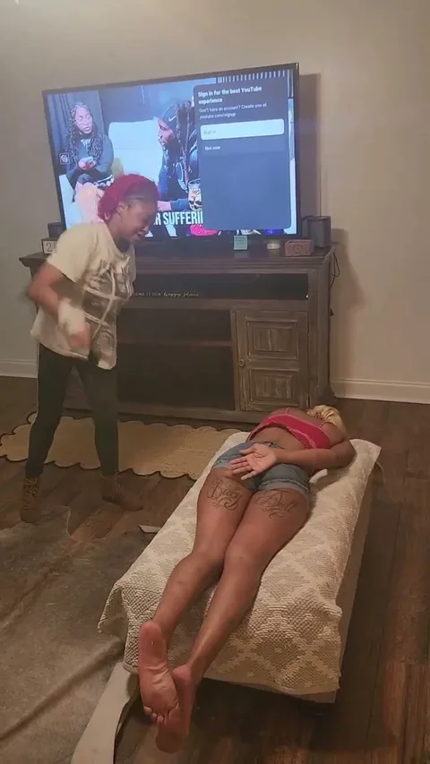 Chick gets a hard spanking laying down still 2