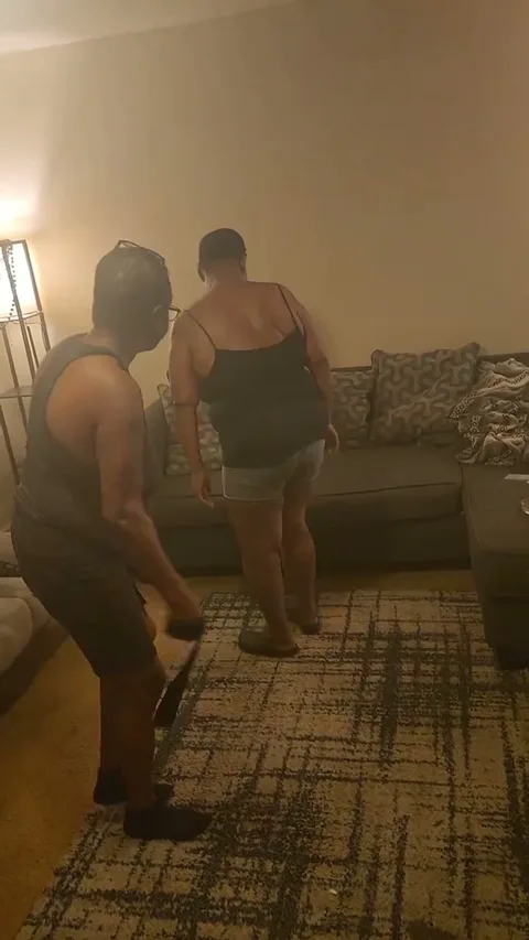 Granny gets a hit with belt in the living room still 3