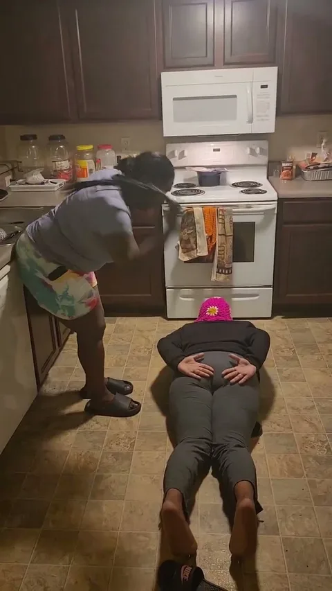 Kila gets spanked on dining room floor still 4