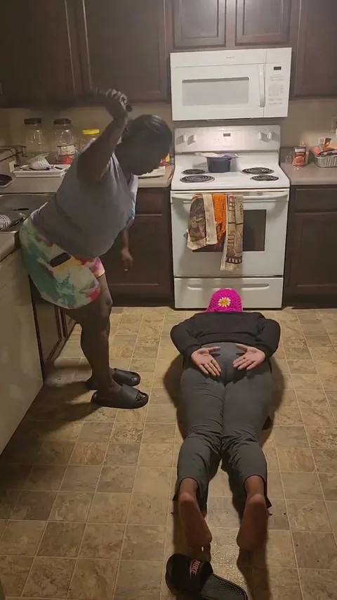 Kila gets spanked on dining room floor still 5