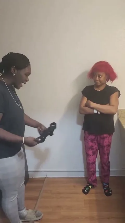 Red hair chick gets a hard spanking stsnding up still 2